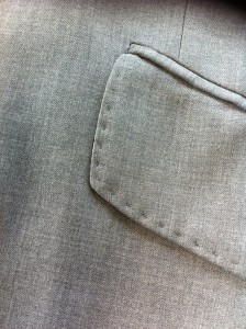 Another machine made pocket and flap. Machine stitched edges.