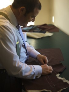 Bespoke tailors yorkshire. This shows me hand basting the canvas onto one side of the coat fronts. 